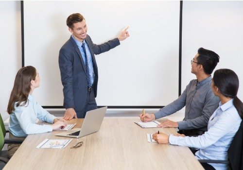 Professional consultant guiding clients through GeM Registration and tender consultancy services during a business meeting